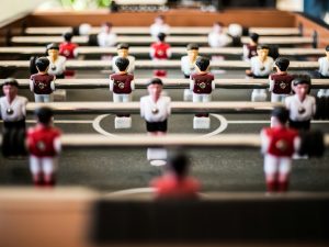 brown foosball table closeup photography