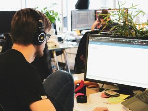 man in black shirt wearing black headphones