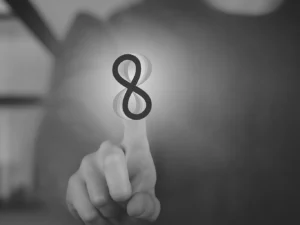 Hand touching eight development infinity logo