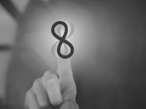 Our Story finger touching eight development infinity logo