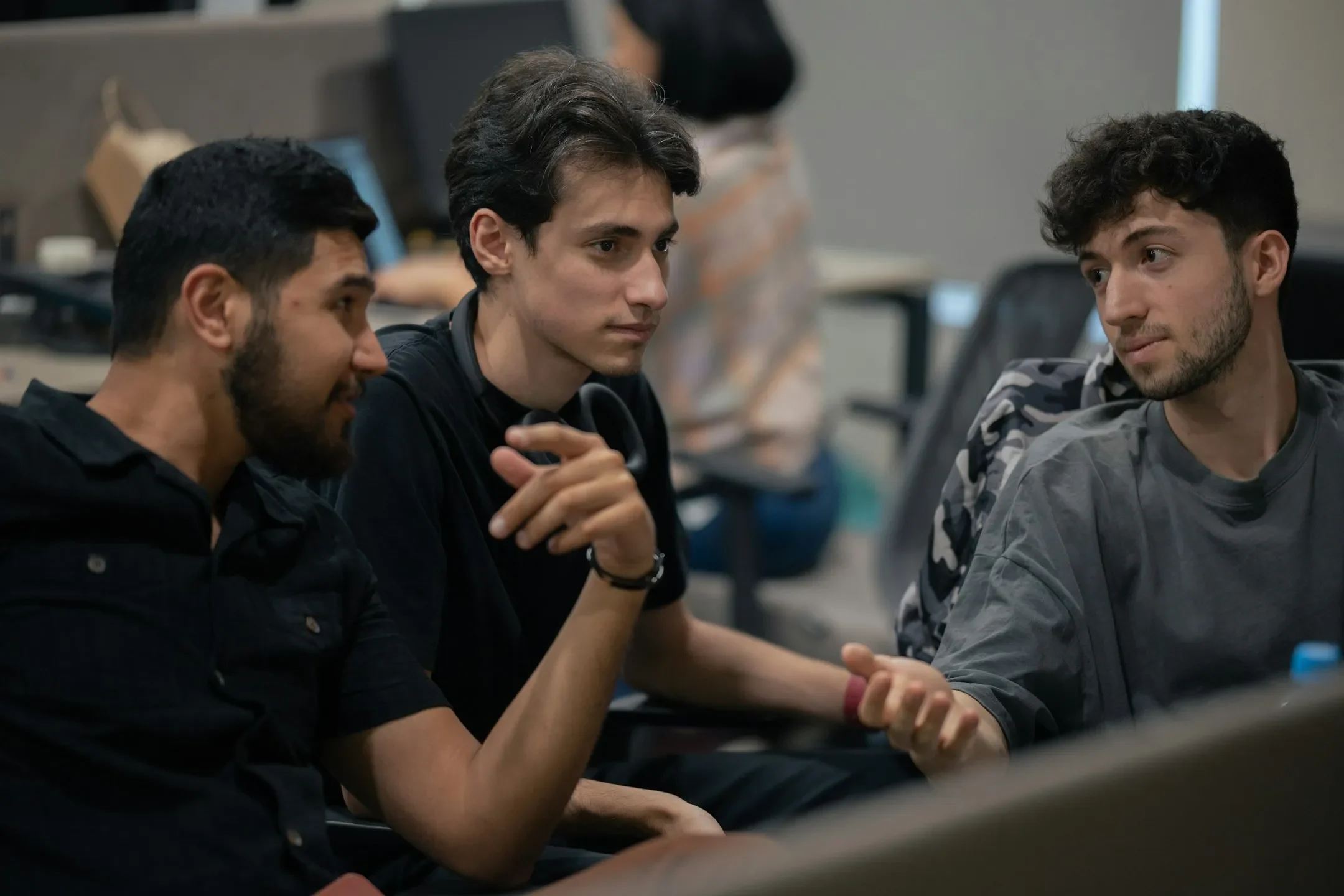 A group of men sitting next to each other